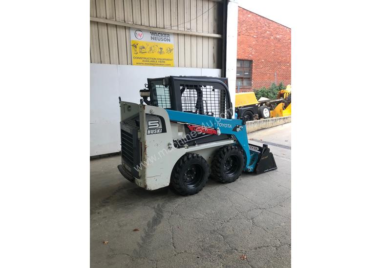 caption TOYOTA HUSKI SKID STEER & TRAILER