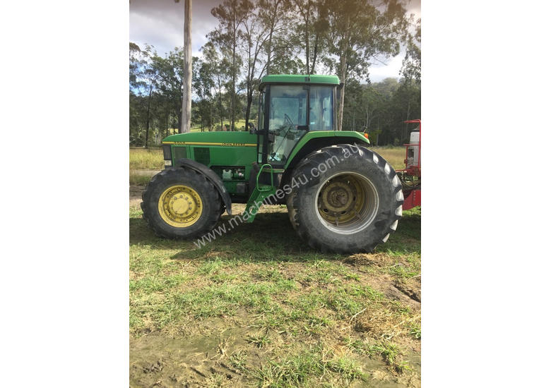 caption John Deere 7700 FWA/4WD Tractor