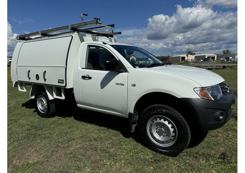 caption Mitsubishi Triton 4x2 Single Cab Traytop Ute