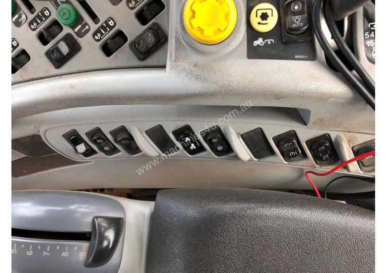 caption 2008 New Holland T7030 tractor