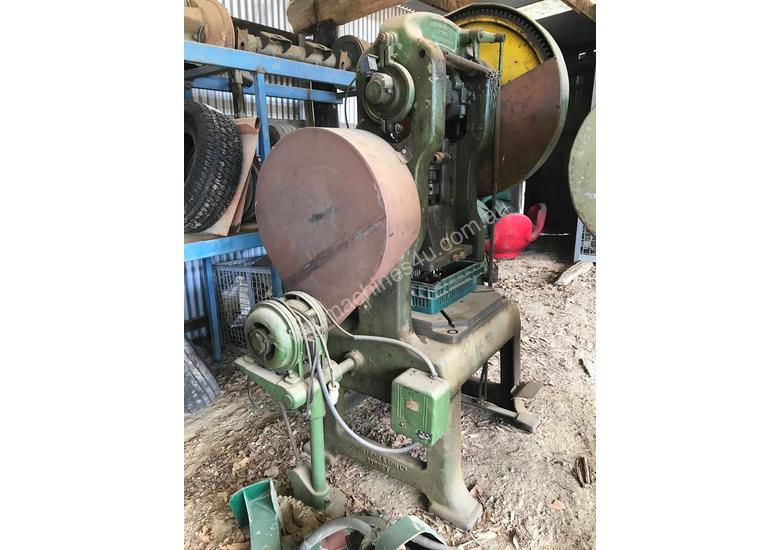 caption Mechanical hole punch