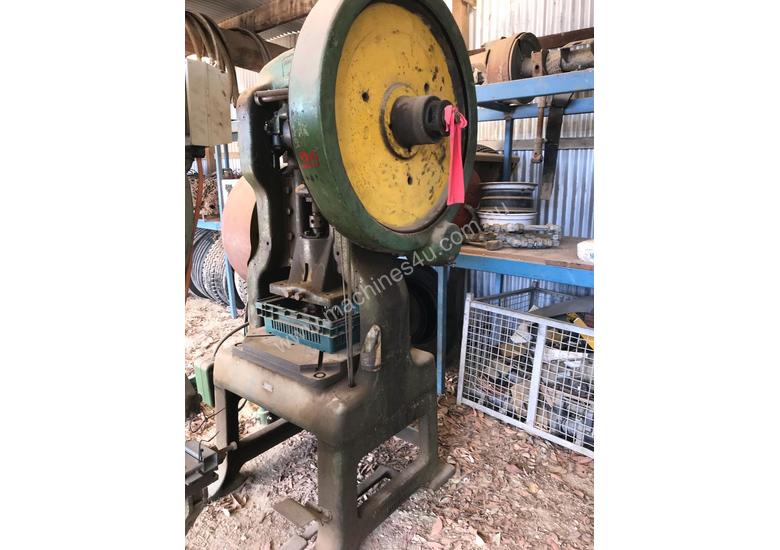 caption Mechanical hole punch