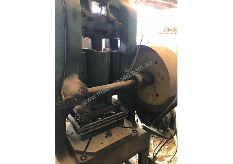caption Mechanical hole punch