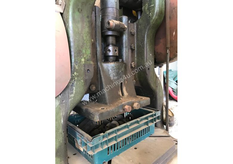 caption Mechanical hole punch