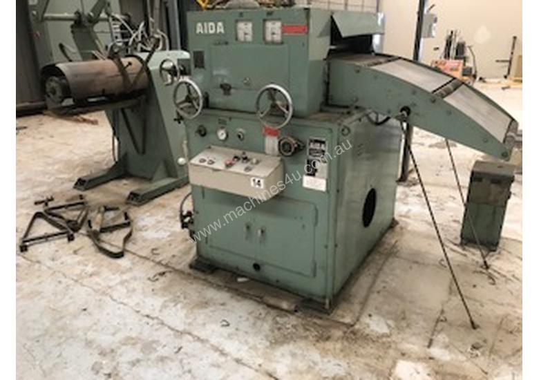 caption COIL STRAIGHTENING MACHINE