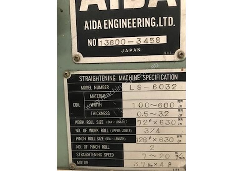 caption COIL STRAIGHTENING MACHINE