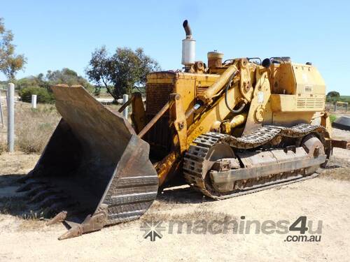 caption 1970 Caterpillar 955K Traxcavator