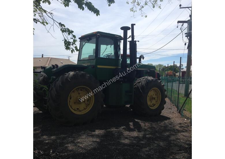 caption John Deere 8450 Articulated Tractor