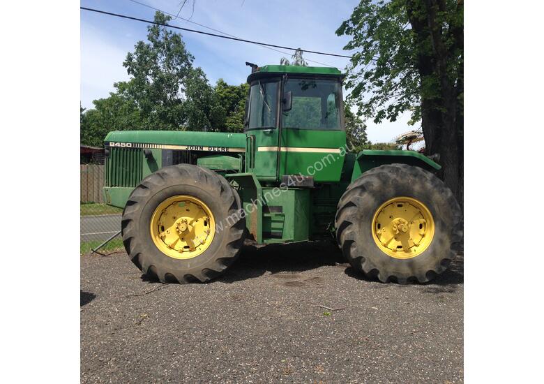 caption John Deere 8450 Articulated Tractor