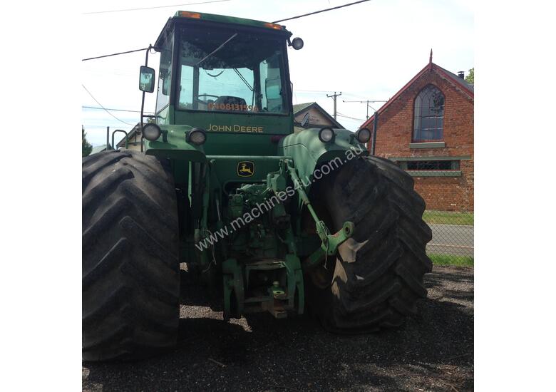 caption John Deere 8450 Articulated Tractor