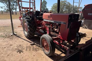 International 383 tractor with forks stick rake and blade