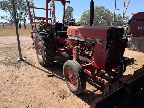 International 383 tractor with forks stick rake and blade