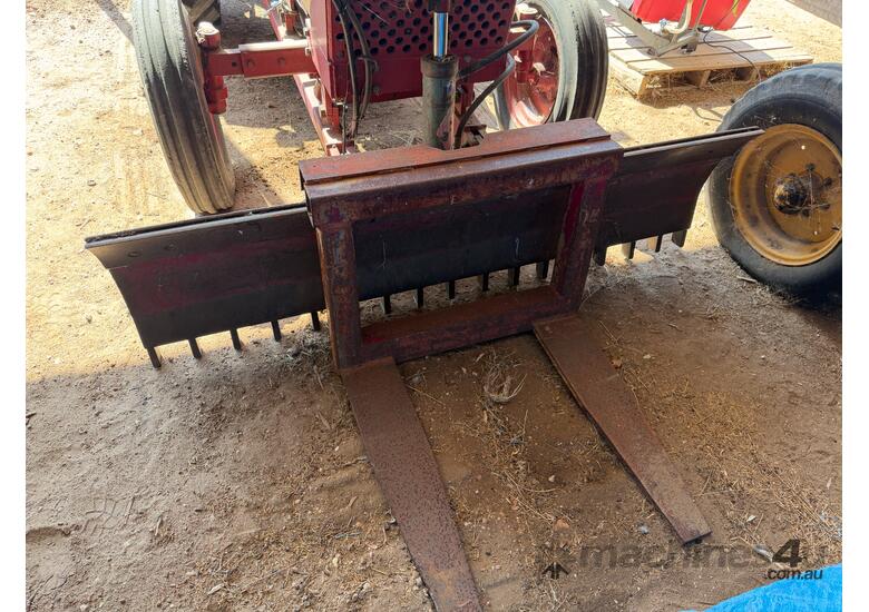 International 383 tractor with forks stick rake and blade