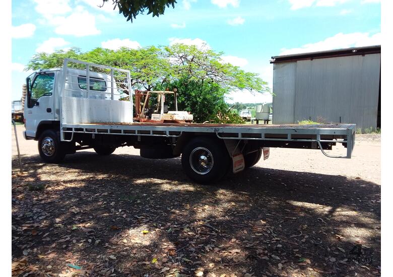 caption Flat bed truck long wheel base