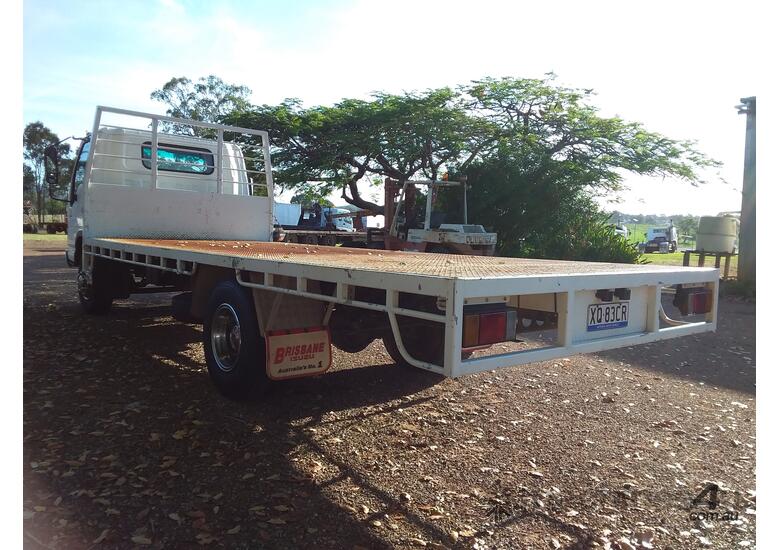 caption Flat bed truck long wheel base
