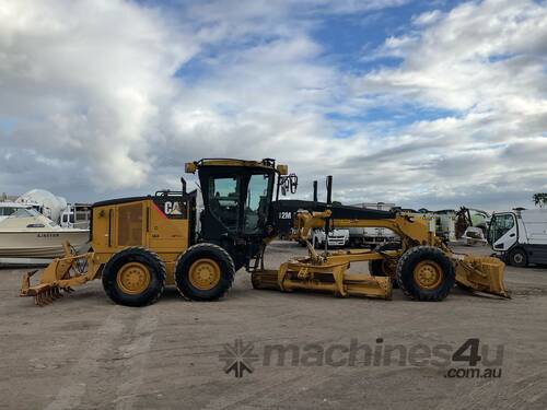 caption 2009 Caterpillar 12M Motor Grader