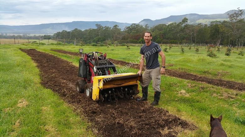 caption NEW DINGO MINI LOADER ROTARY HOE