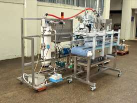 Liquid Filling and Capping Machine using Flowmeter with Inline Filter - picture0' - Click to enlarge