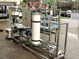 Liquid Filling and Capping Machine using Flowmeter with Inline Filter - picture1' - Click to enlarge