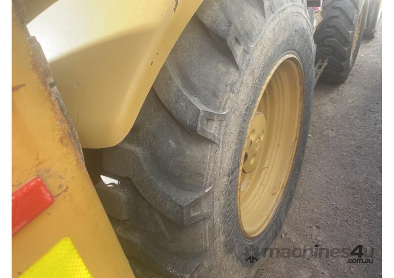 caption Caterpillar 432E Front End Loader/Backhoe