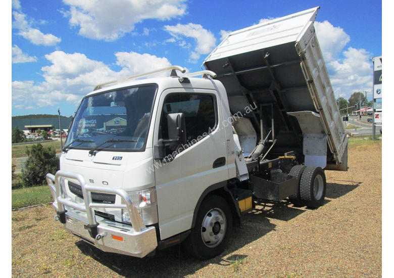 caption Mitsubishi Canter 715 Tipper Truck