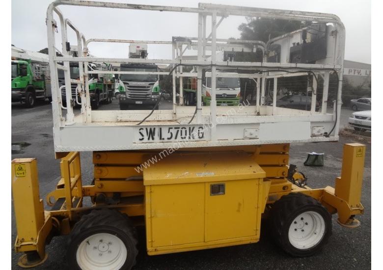 caption JLG 260MRT 4 Wheel drive, diesel scissor lift