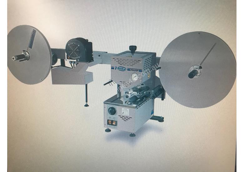 caption PRE-GLUER FOR EDGING TAPE