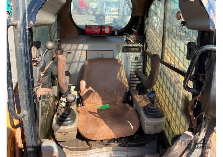 caption 2010 Caterpillar 246C Skid Steer