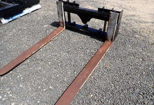 Fork carriage for skid steers