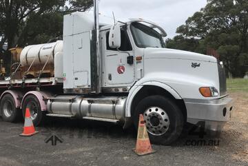 2007 International Eagle and 2010 Bailey Bodybuilders TRI350 tri axle drop deck trailer