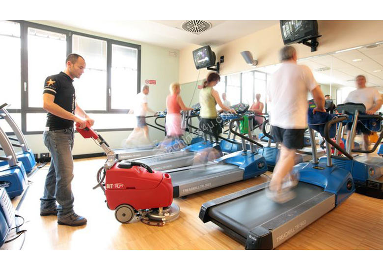caption RCM Bit Walk Behind Floor Scrubber