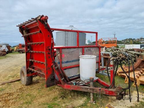 caption CMI Hay Feed Out Wagon