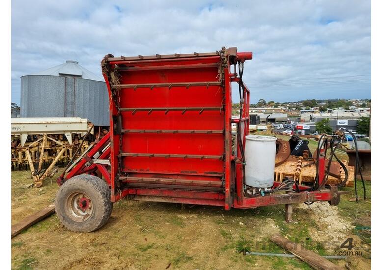 caption CMI Hay Feed Out Wagon