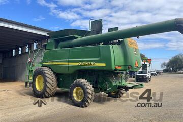 JOHN DEERE 9760 STS & 936D Front on Trailer