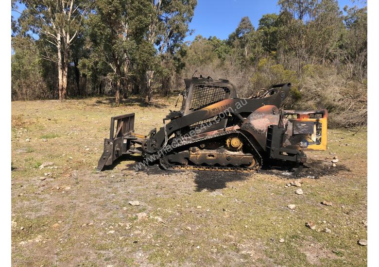 caption Caterpillar 299c wrecking