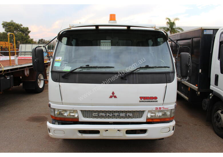caption Mitsubishi 2004 Canter Tray Top Tip Truck