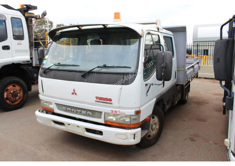 caption Mitsubishi 2004 Canter Tray Top Tip Truck