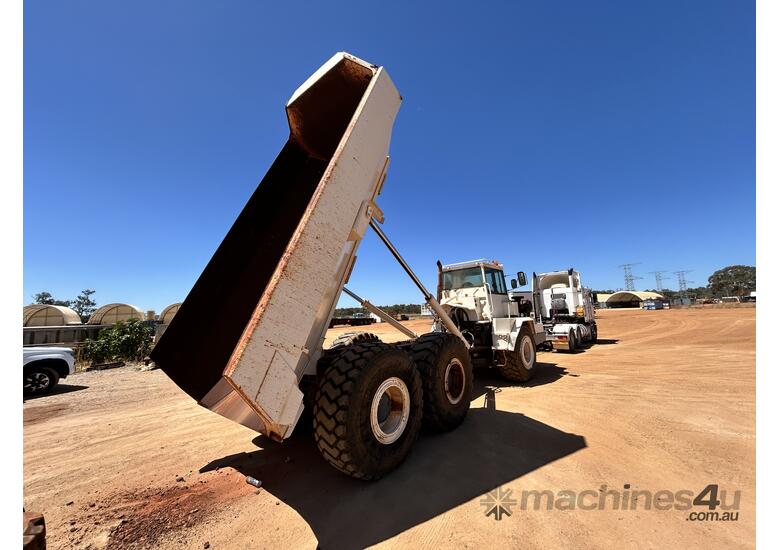 caption TEREX AT25 Articulated Dump Truck With Spare Truck