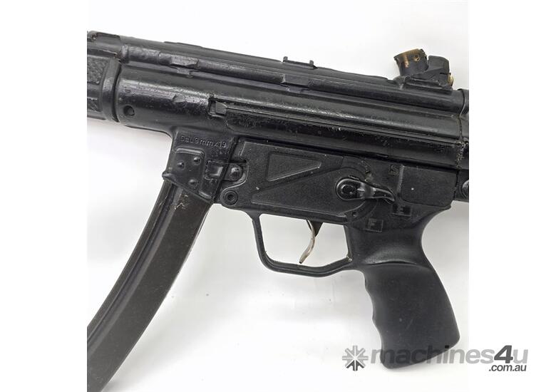 caption AN EX POLICE TRAINING MP5 MACHINE GUN