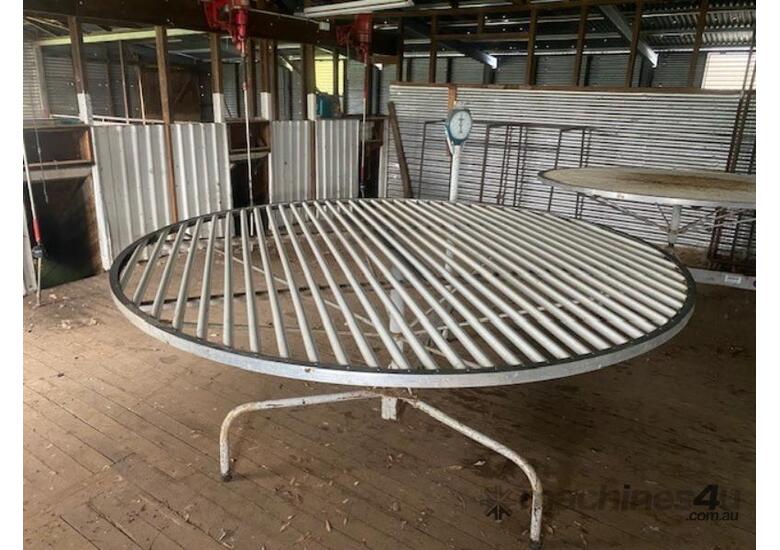 caption LYCO STEVLYON ROUND WOOL TABLE WITH SCALES.