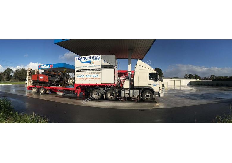 caption Ditch Witch JT3020 All Terrain Horizontal Directional Drill and Volvo Semitrailer