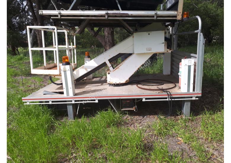 caption UTILITY MOUNTED CHERRY PICKER