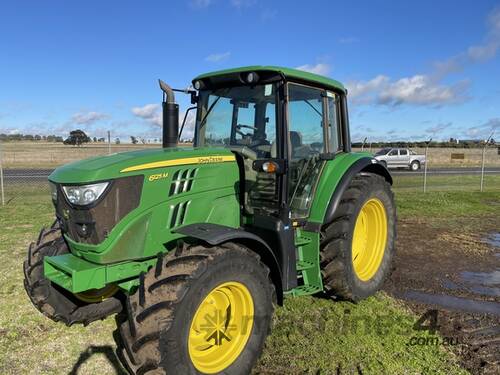 caption 2014 John Deere 6125M Utility Tractors