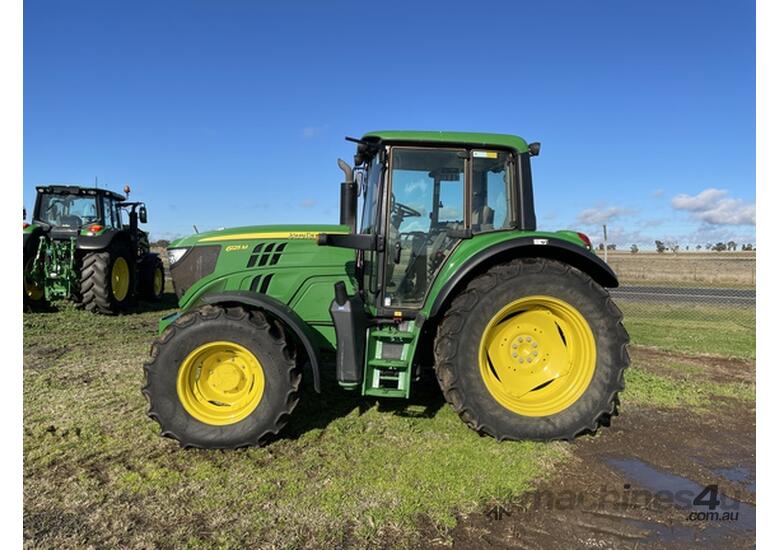 caption 2014 John Deere 6125M Utility Tractors