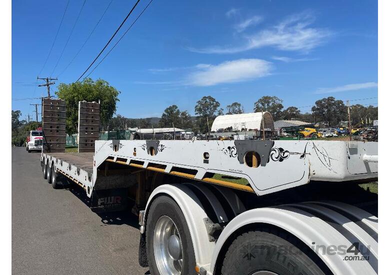 caption FWR DROP DECK TRI AXLE WIDENING TRAILER.