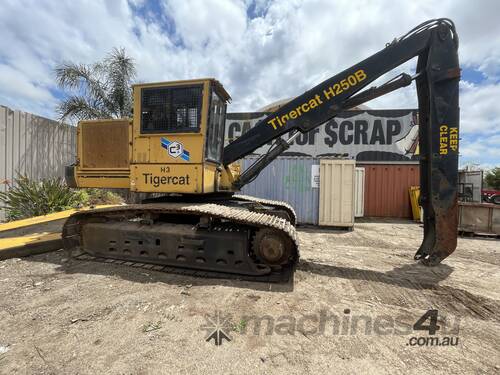 Tigercat 250D excavator with 3 finger metal grab