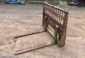 Pallet forks to skid steer