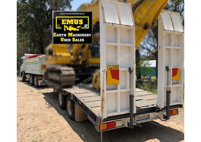 caption 2003 Hino Tipper & 2007 Tag Trailer. E.M.U.S. TS534