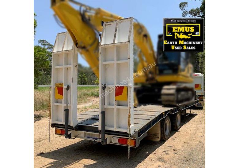 caption 2003 Hino Tipper & 2007 Tag Trailer. E.M.U.S. TS534