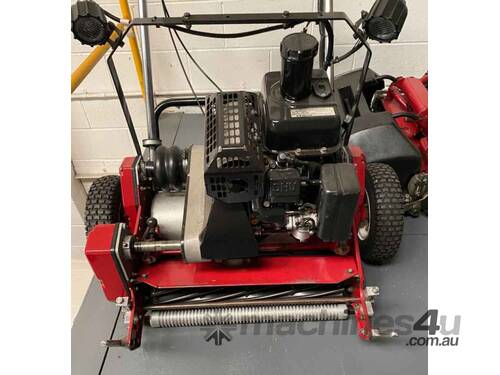 caption Toro Greensmaster 1000 - Ideal for Maintaining Consistent Grass Height - Priced to Sell!